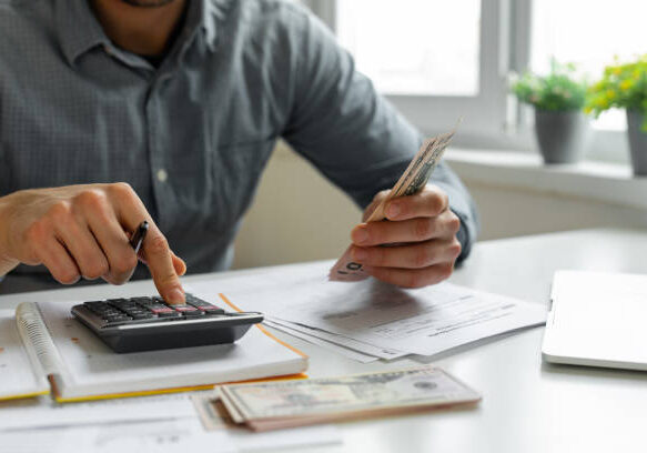 Man using calculator